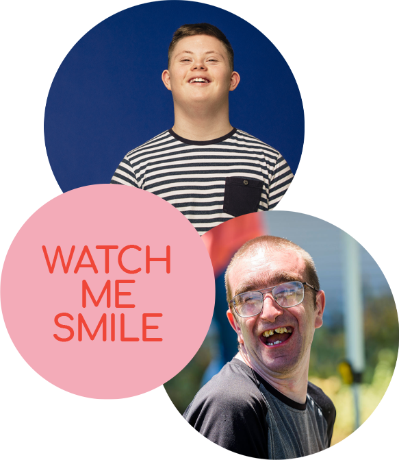 Two young men smiling from ear to ear at EllieB's (Disability Services)