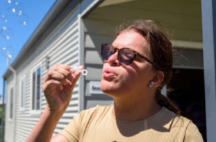 Blowing bubbles at EllieB's Respite Short Stay Day Options summer event